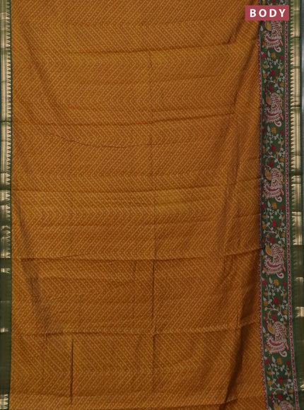 Semi maheswari cotton saree dark mustard and sap green with allover ikat prints and zari woven border