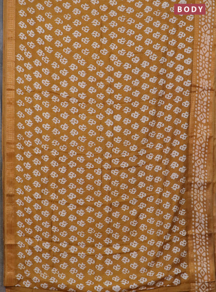 Semi maheswari cotton saree dark mustard with allover batik prints and rettapet printed border