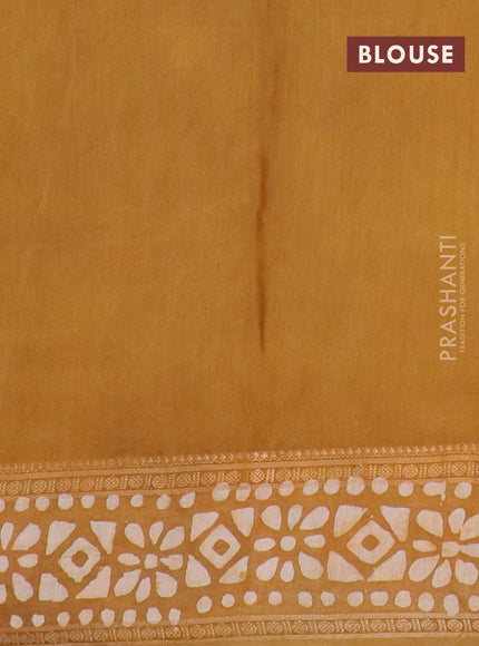 Semi maheswari cotton saree dark mustard with allover batik prints and rettapet printed border