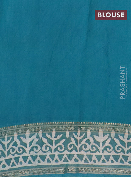 Semi maheswari cotton saree teal green with allover batik prints and rettapet printed border