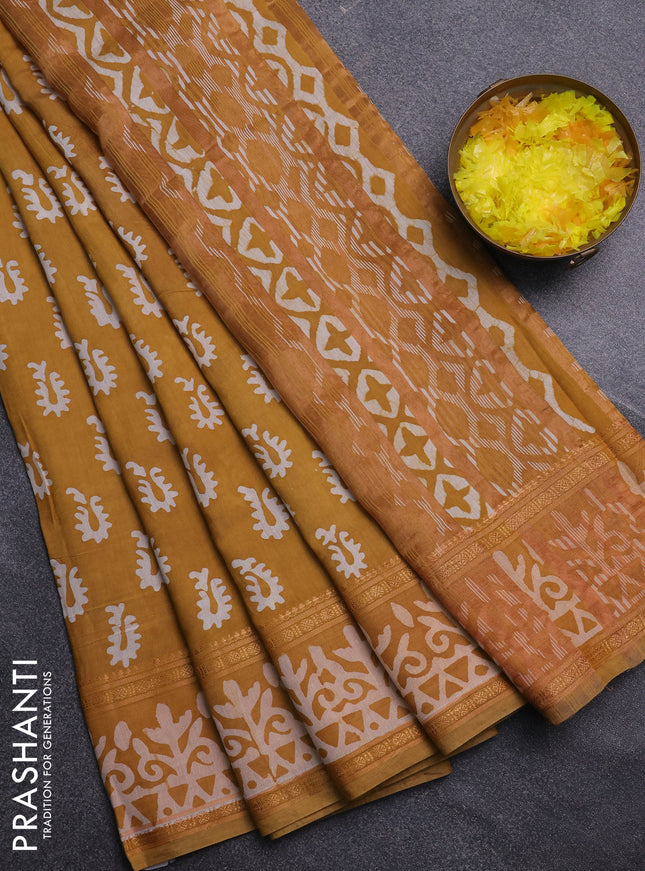 Semi maheswari cotton saree mustard yellow with allover batik prints and rettapet printed border