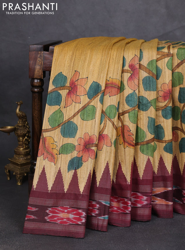 Pure tussar silk saree sandal and maroon with allover kalamkari hand painted prints and temple design zari woven ikat border