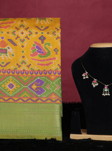 Yellow and green semi tussar saree with matching Neck piece