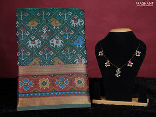 Bottle green semi tussar saree with matching Neck piece