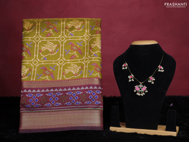 Mehendi green semi tussar saree with matching Neck piece