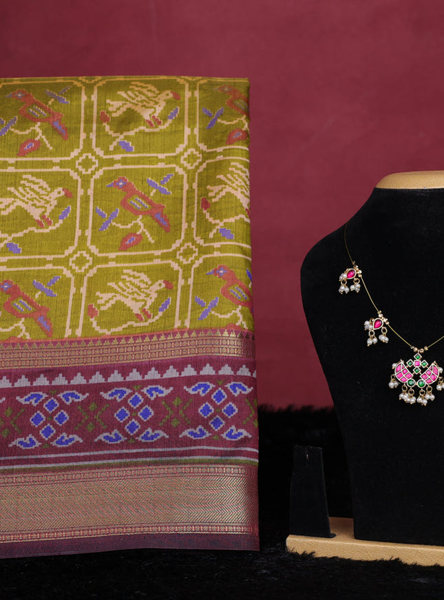Mehendi green semi tussar saree with matching Neck piece