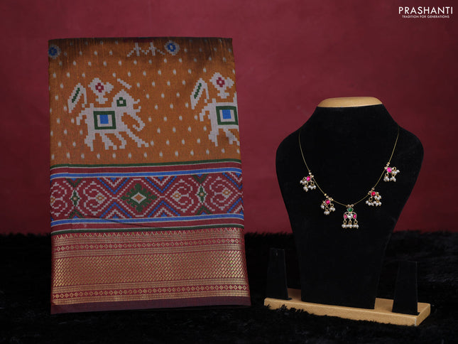 Dark mustard semi tussar saree with matching Neck piece