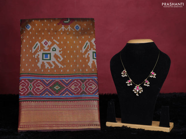 Dark mustard semi tussar saree with matching Neck piece