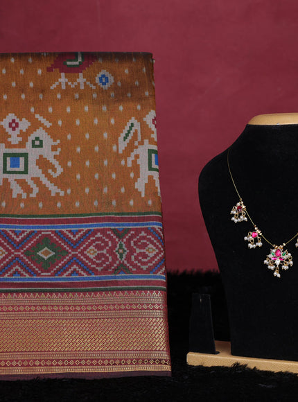 Dark mustard semi tussar saree with matching Neck piece