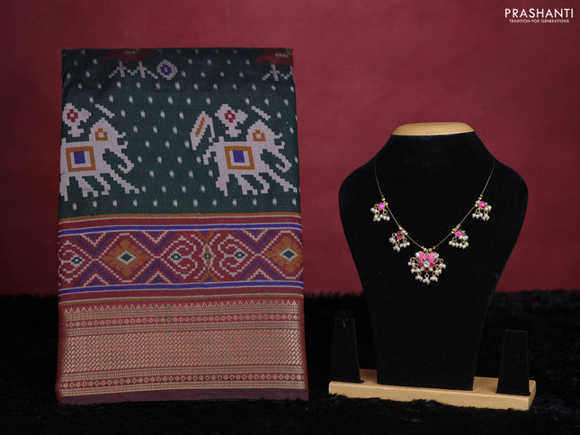 Bottle green semi tussar saree with matching Neck piece
