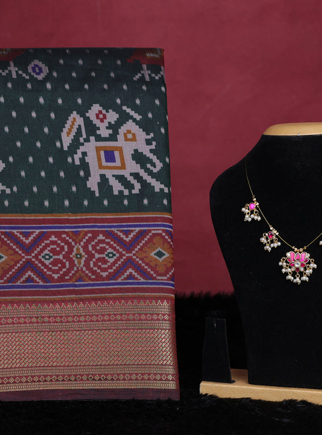Bottle green semi tussar saree with matching Neck piece