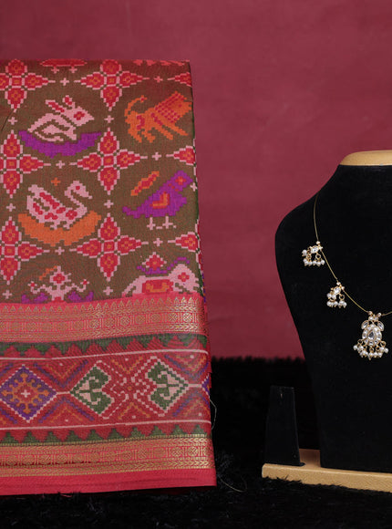 Manthulir green semi tussar saree with matching Neck piece