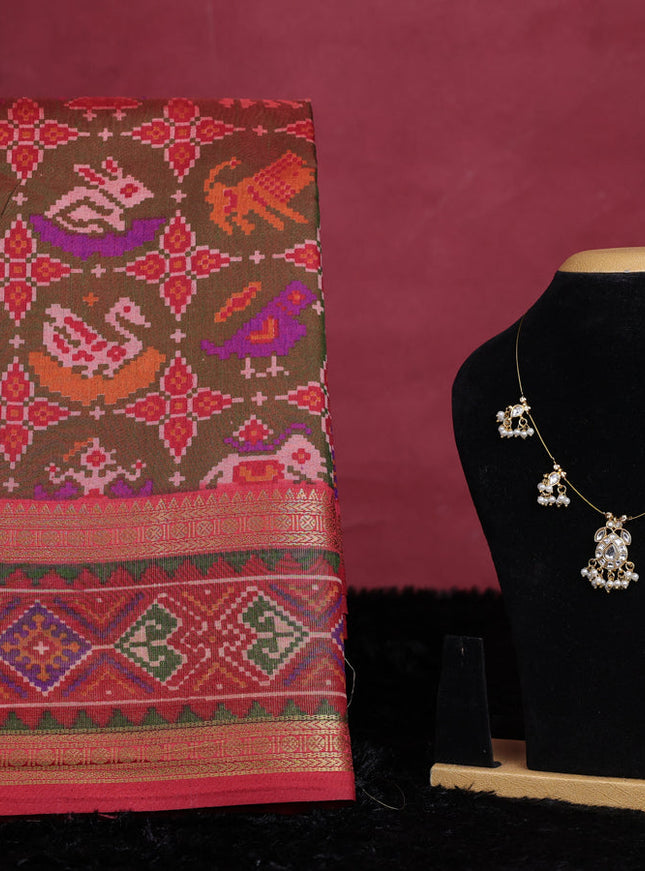Manthulir green semi tussar saree with matching Neck piece