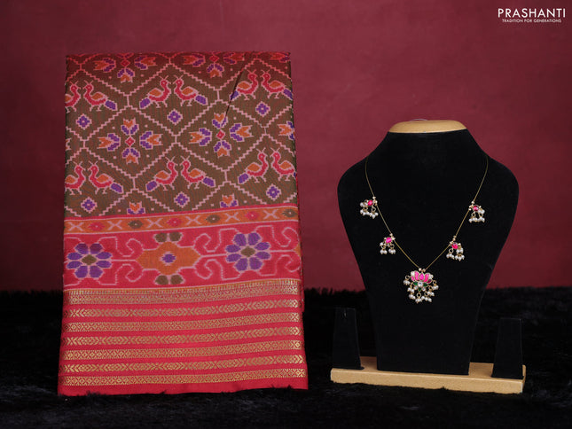Manthulir green semi tussar saree with matching Neck piece