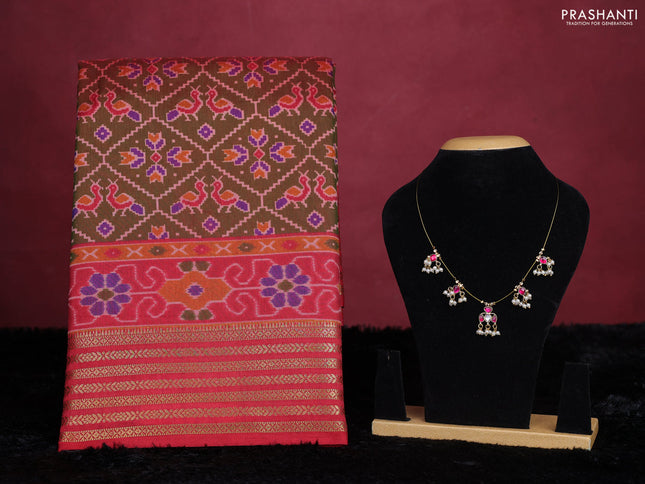Manthulir green semi tussar saree with matching Neck piece