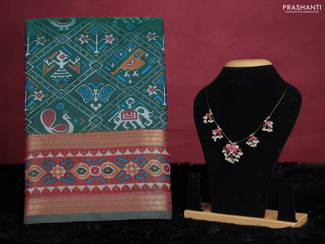 Dark green semi tussar saree with matching Neck piece