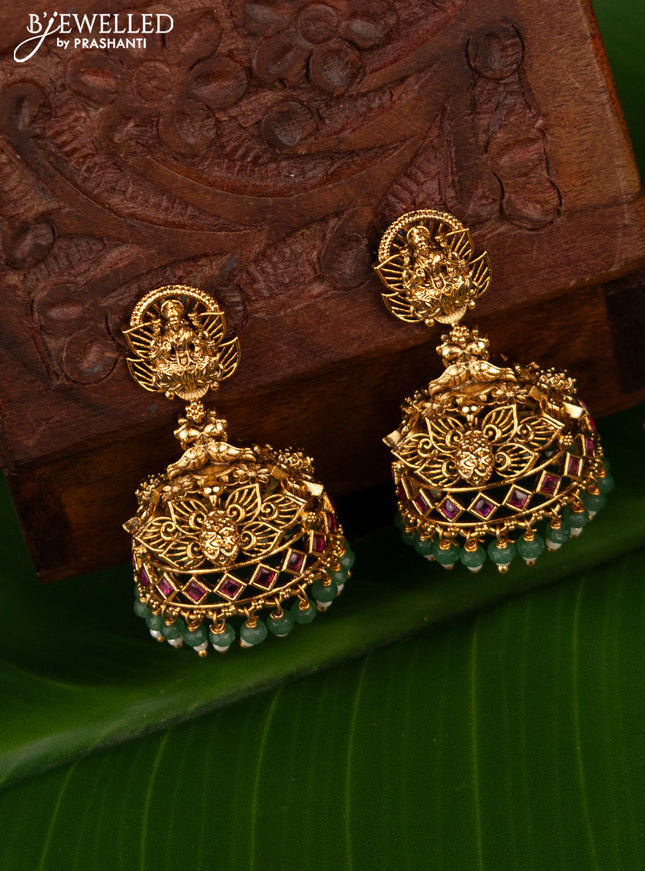 Antique jhumka lakshmi design with kemp stones and green beads hanging