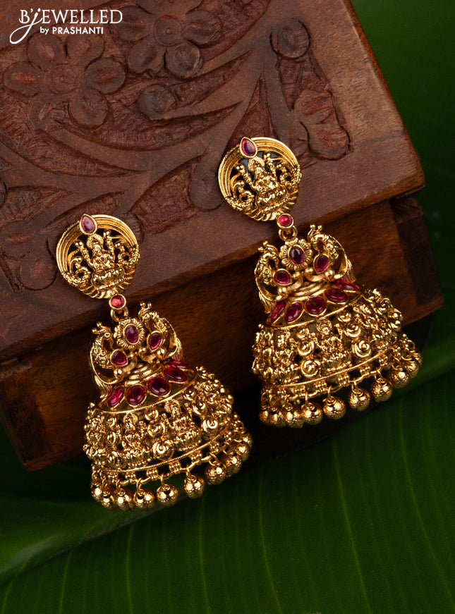 Antique jhumka lakshmi design with pink kemp stones and golden beads hanging