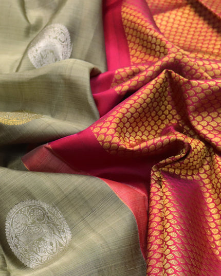 Pure kanjivaram silk saree elaichi green and pink with zari woven buttas in borderless style