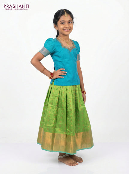 Silk kids lehenga teal blue and light green with aari work neck pattern & puff sleeve and copper zari buttas & copper zari border for 7-8 years