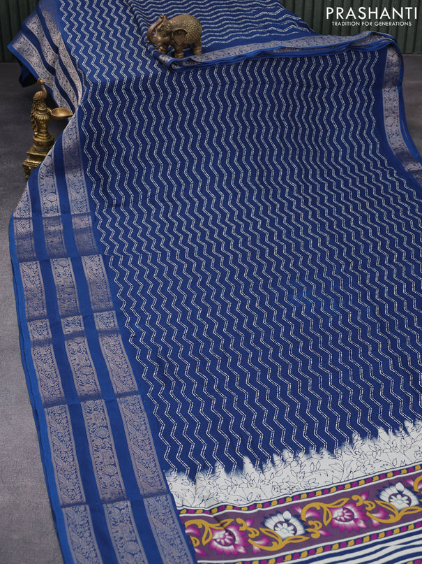 Semi georgette saree cs blue with allover zig zag prints and long zari woven border