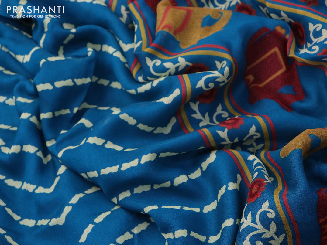 Semi georgette saree cs blue with allover zig zag prints and long zari woven border