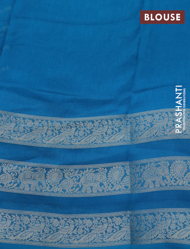 Semi georgette saree cs blue with allover zig zag prints and long zari woven border