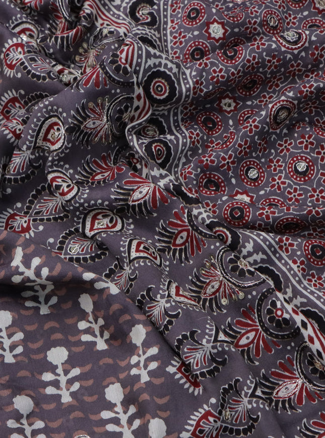 Muslin silk saree grey with allover dabu prints & pita work and ajrakh printed border
