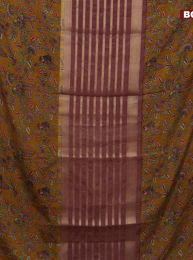 Semi crepe saree pastel brown and dark mustard with zari weaves and long kalamkari printed zari border