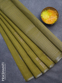 Matka tussar saree mehendi green with silver & gold zari weaves and piping border