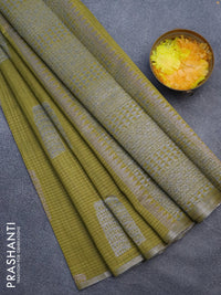 Matka tussar saree mehendi green with thread & silver zari woven buttas and piping border