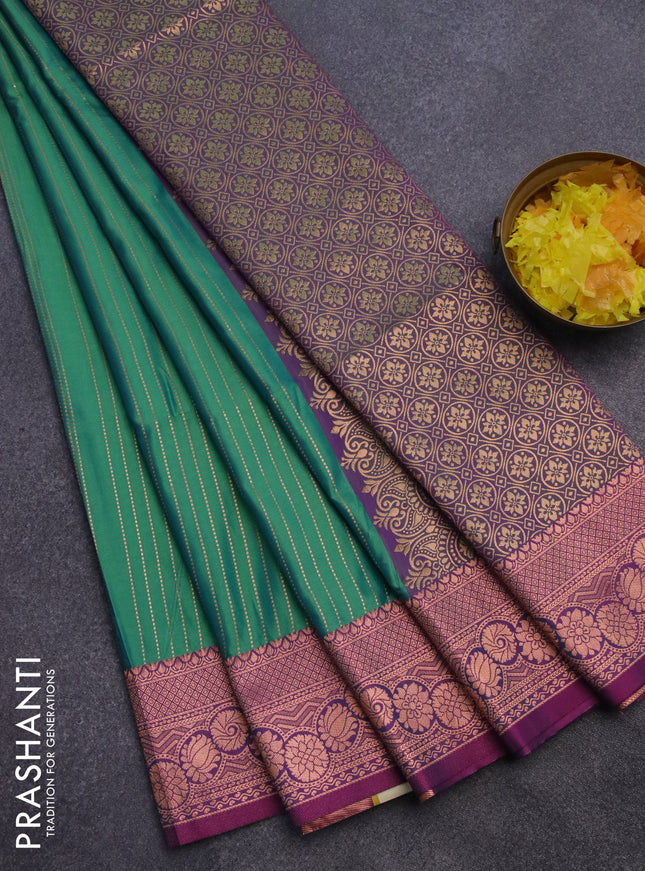 Semi soft silk saree dual shade of green and dual shade of purple with allover copper zari weaves and copper zari woven border