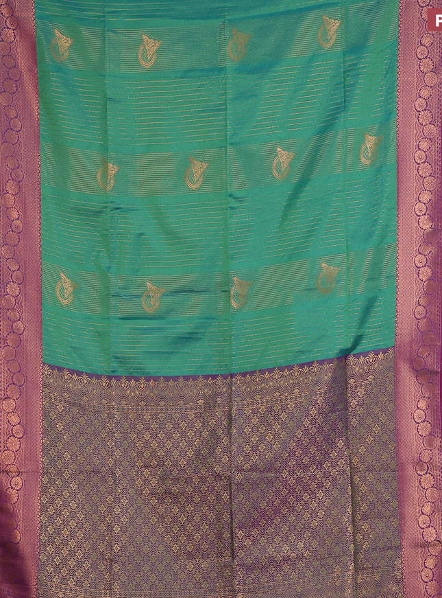 Semi soft silk saree dual shade of green and dual shade of purple with allover copper zari weaves and copper zari woven border