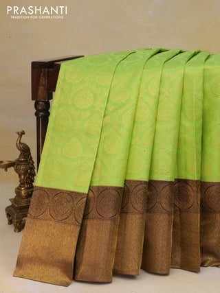 Pure kanchipuram silk saree light green and deep jamun shade with allover zari woven brocade weaves and long zari woven border