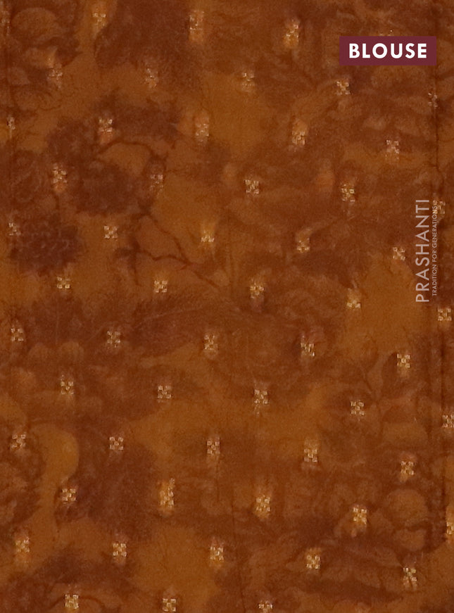 Semi crepe saree dark mustard and brown shade with zari stripes & kalamkari prints and zari woven border