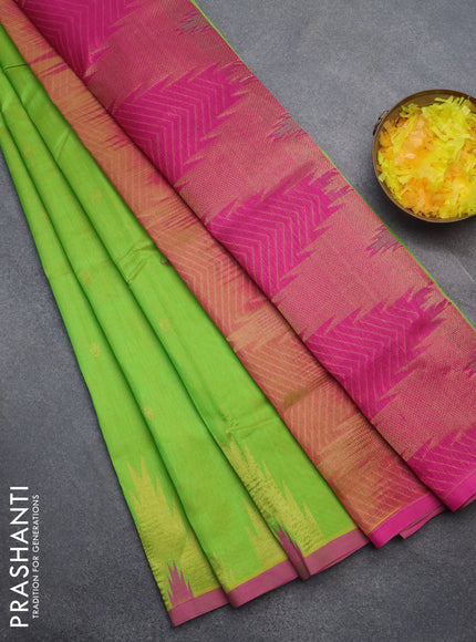 Silk cotton saree fluorescent green and pink with zari woven buttas and temple deisgn zari woven border