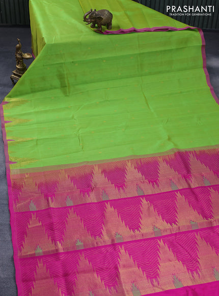 Silk cotton saree fluorescent green and pink with zari woven buttas and temple deisgn zari woven border