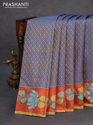 Pure kanchipuram silk saree blue shade and rustic orange with allover zari woven brocade weaves and kalamkari printed pallu & border