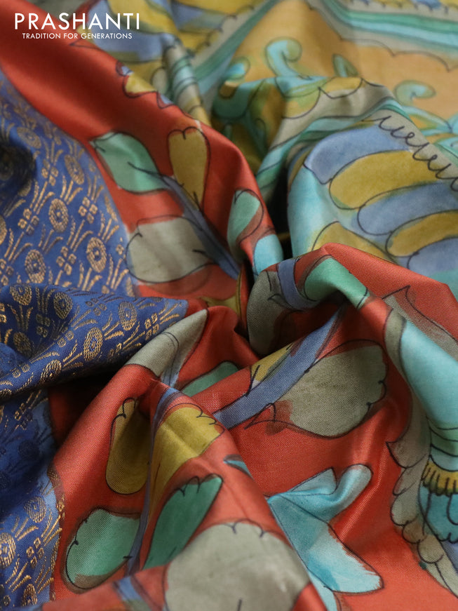 Pure kanchipuram silk saree blue shade and rustic orange with allover zari woven brocade weaves and kalamkari printed pallu & border
