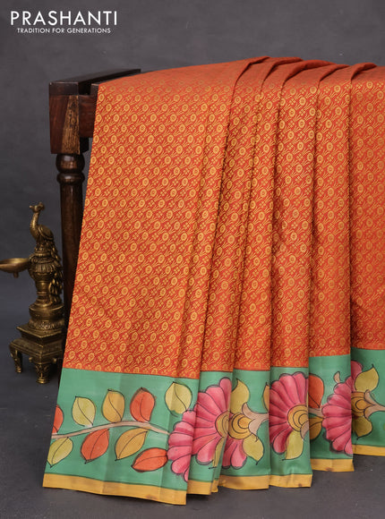 Pure kanchipuram silk saree rustic orange and teal blue shade with allover zari woven brocade weaves and kalamkari printed pallu & border