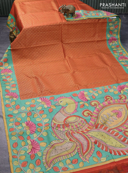 Pure kanchipuram silk saree rustic orange and teal blue shade with allover zari woven brocade weaves and kalamkari printed pallu & border