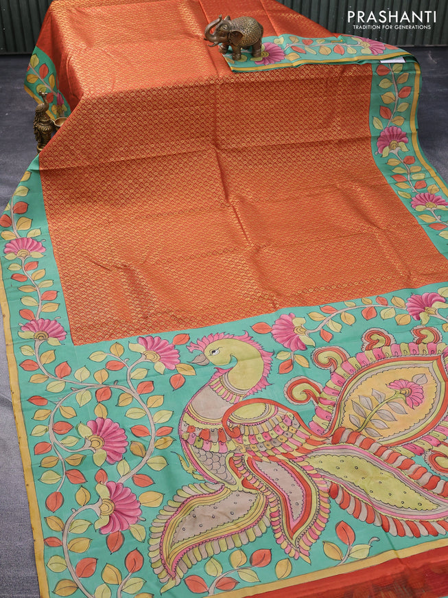 Pure kanchipuram silk saree rustic orange and teal blue shade with allover zari woven brocade weaves and kalamkari printed pallu & border