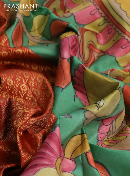 Pure kanchipuram silk saree rustic orange and teal blue shade with allover zari woven brocade weaves and kalamkari printed pallu & border