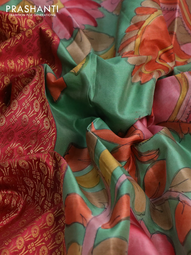 Pure kanchipuram silk saree maroon shade and pastel green shade with allover zari woven brocade weaves and kalamkari printed pallu & border
