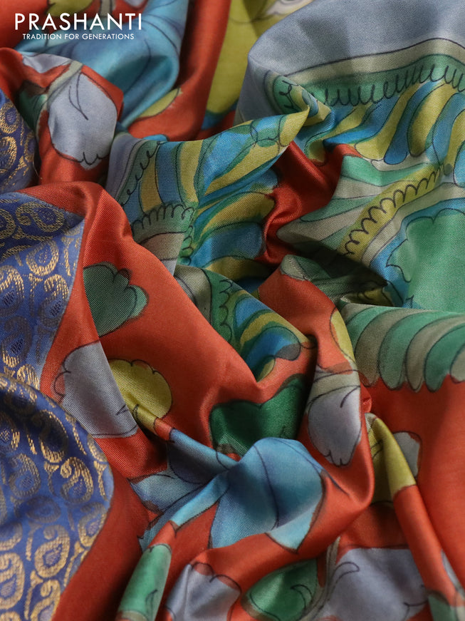 Pure kanchipuram silk saree blue shade and rustic orange with allover zari woven paisley brocade weaves and kalamkari printed pallu & border