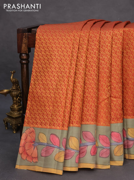 Pure kanchipuram silk saree rustic orange and grey shade with allover zari woven paisley brocade weaves and kalamkari printed pallu & border