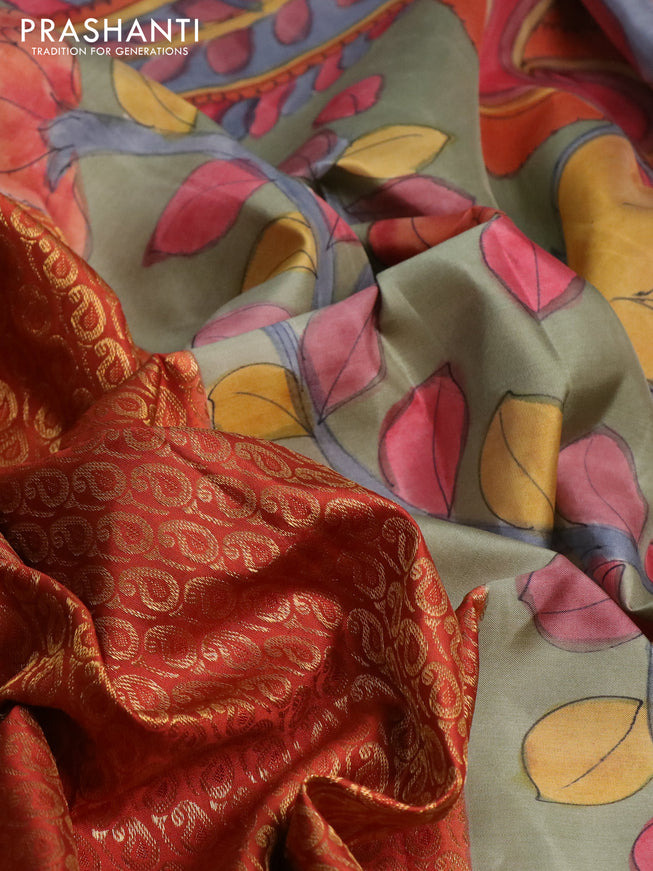 Pure kanchipuram silk saree rustic orange and grey shade with allover zari woven paisley brocade weaves and kalamkari printed pallu & border