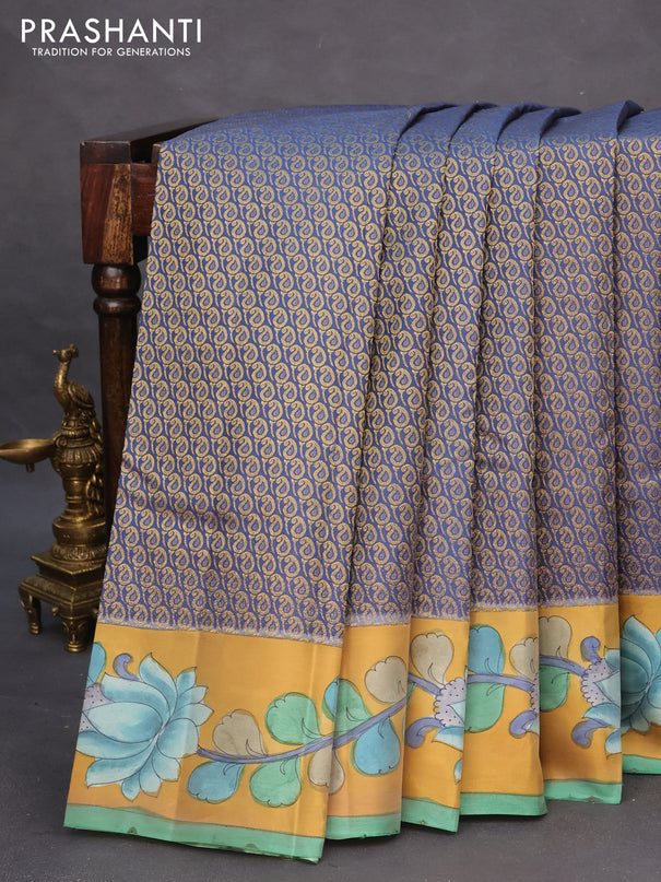 Pure kanchipuram silk saree blue shade and mustard yellow with allover zari woven paisley brocade weaves and kalamkari printed pallu & border