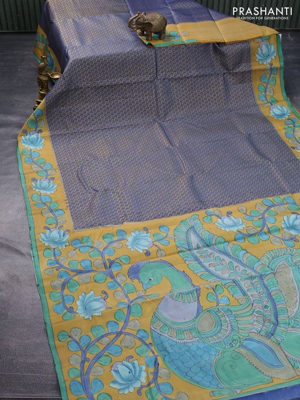 Pure kanchipuram silk saree blue shade and mustard yellow with allover zari woven paisley brocade weaves and kalamkari printed pallu & border