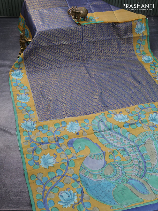 Pure kanchipuram silk saree blue shade and mustard yellow with allover zari woven paisley brocade weaves and kalamkari printed pallu & border